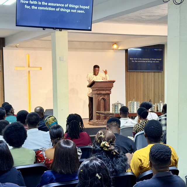 Pastor preaching from the pulpit during Sunday service